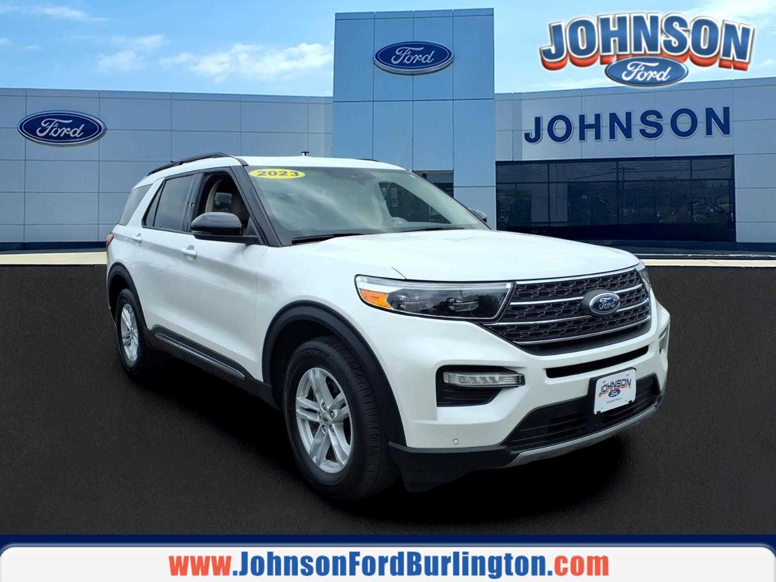 2023 Ford Explorer XLT in Star White Metallic Tri-Coat — front three-quarter view