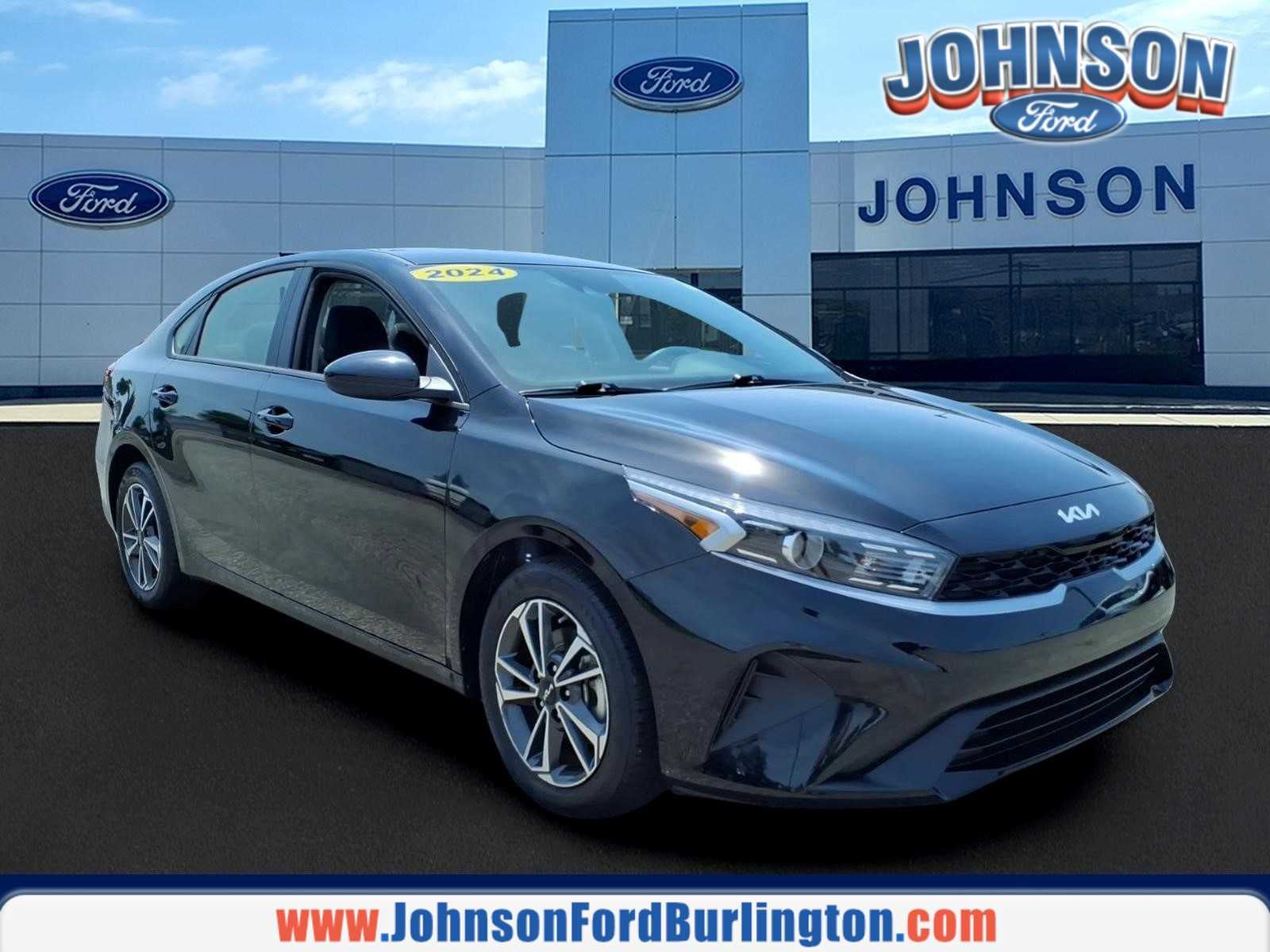 2024 Kia Forte LXS in Aurora Black — front three-quarter view